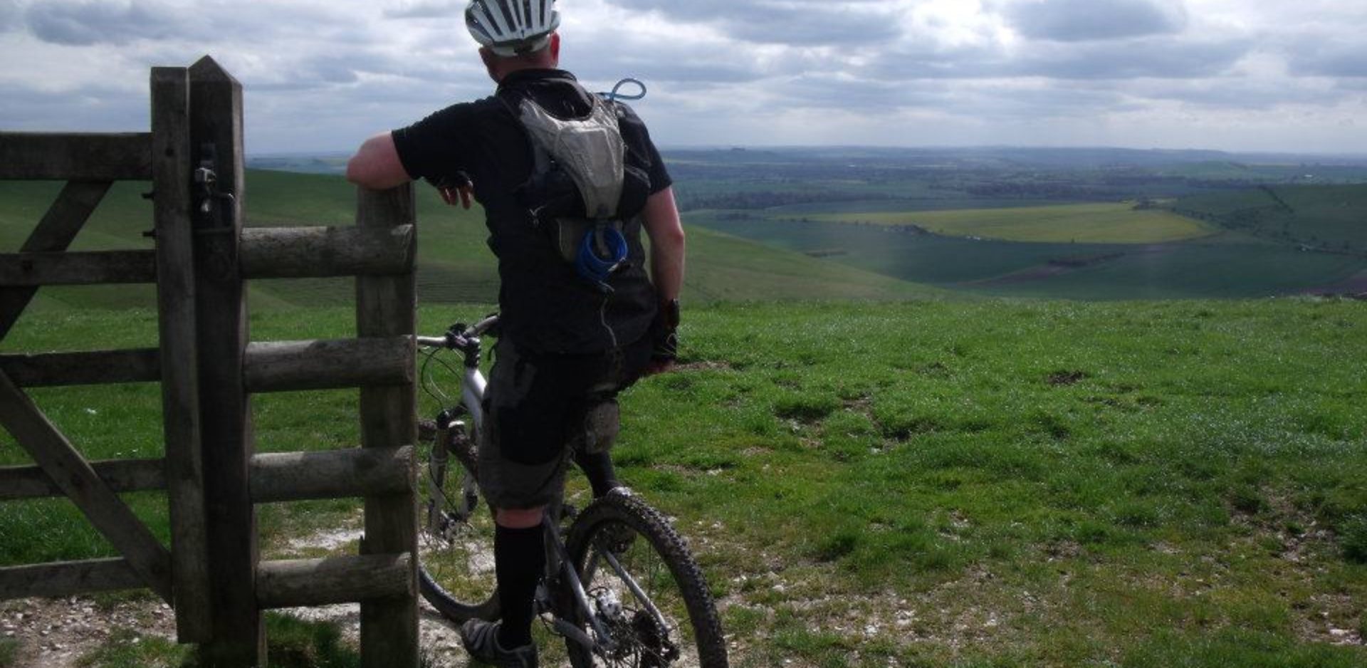 Cyclist overlooking Pewsey Vale