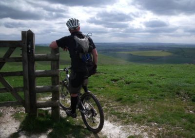 Cyclist overlooking Pewsey Vale
