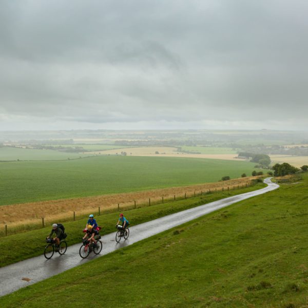 Four cyclists on a country road