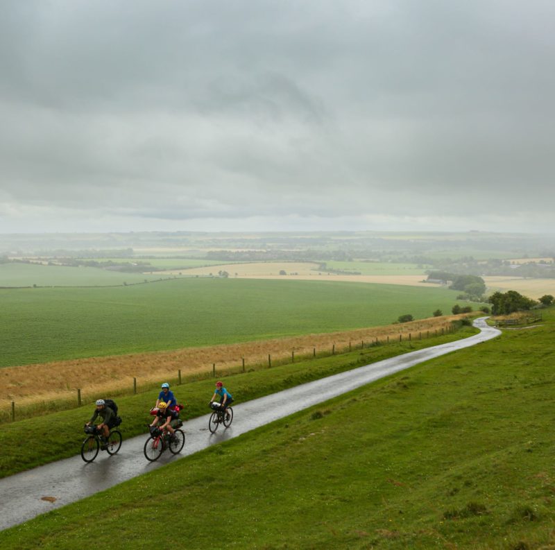 Four cyclists on a country road